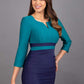 A model is wearing a three quarter sleeve colour block pencil dress by Diva Catwalk in navy and green colour