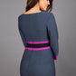 brunette model wearing Diva catwalk Paeonia dress square neckline with a vent in slate grey with dawn purple and black stripes around the waist and three quarter sleeve with dawn purple contrast finish back