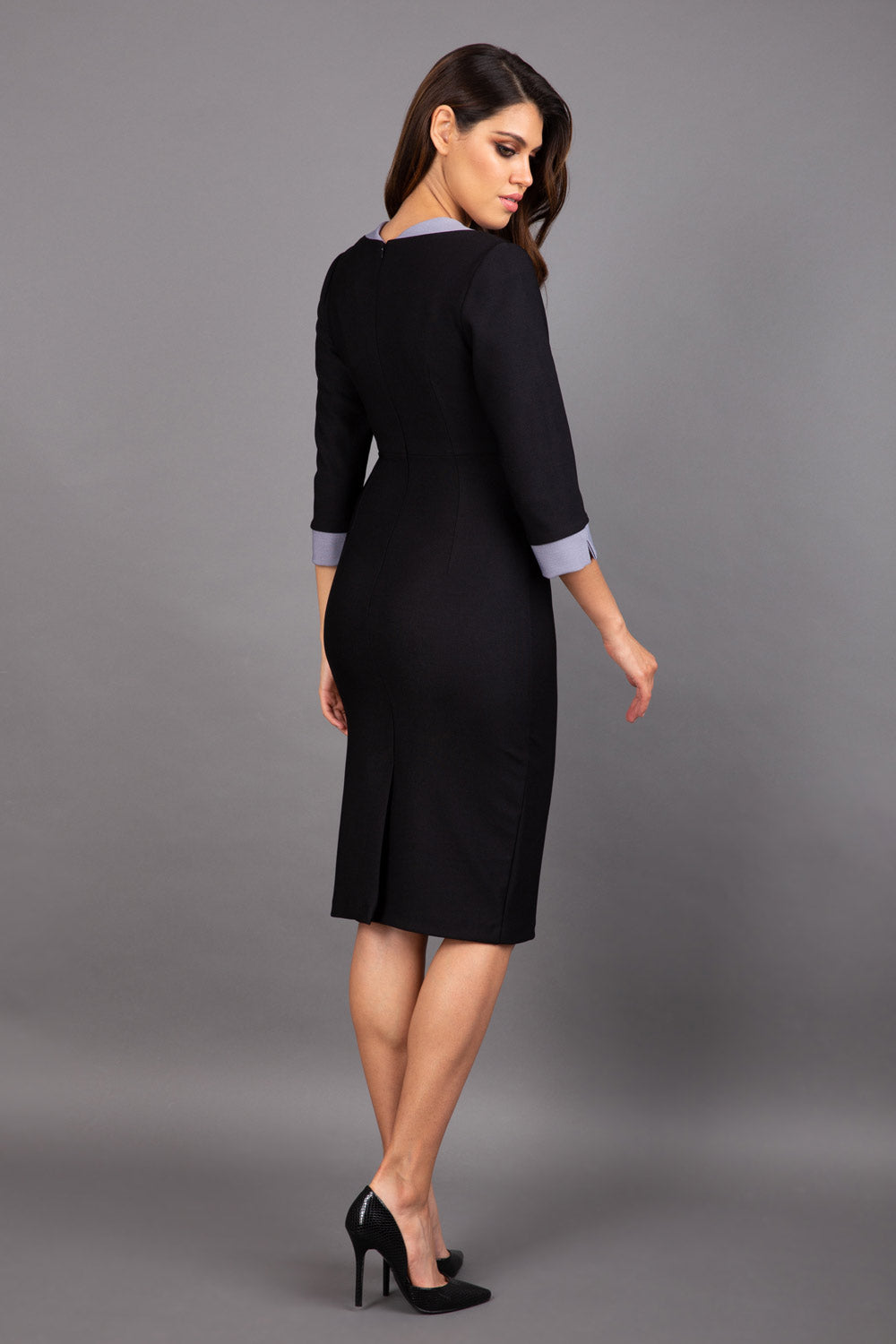 Model wearing Diva catwalk Cirrus figure fitted pencil dress in black/steel grey, three quarter sleeve back image