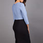 Model wearing Diva catwalk Katykat pencil figure fitted dress in black and steel grey detail with three quarter sleeve back image