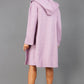 brunette model wearing diva catwalk hooded coat with long sleeves in soft cosy cashmere in pink back
