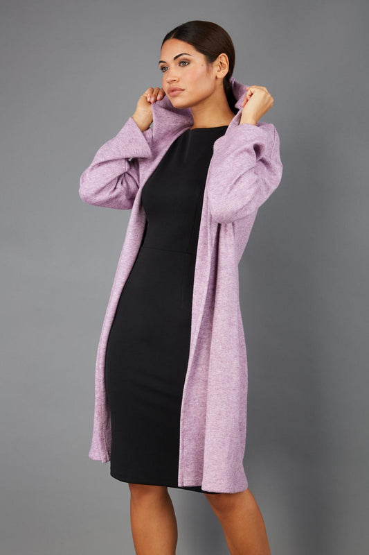 brunette model wearing diva catwalk hooded coat with long sleeves in soft cosy cashmere in pink front