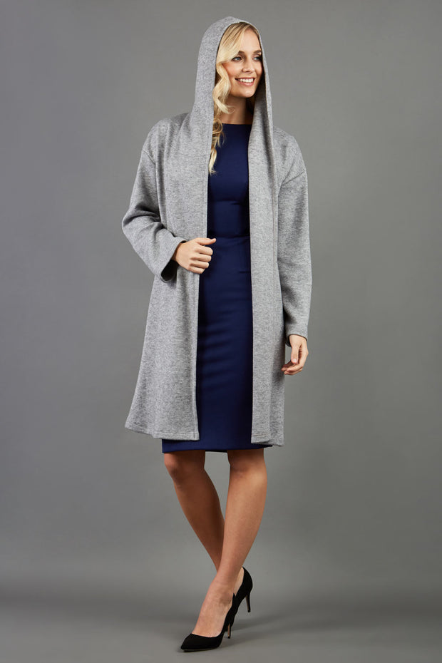 blonde model wearing diva catwalk hooded coat with long sleeves in soft cosy cashmere in grey front