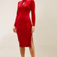 brunette model wearing diva catwalk clipper pencil skirt dress velvet sleeved style with a keyhole detail and high neck and split on a side of the skirt in colour red front