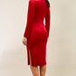 brunette model wearing diva catwalk clipper pencil skirt dress velvet sleeved style with a keyhole detail and high neck and split on a side of the skirt in colour red back