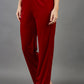 model wearing diva catwalk pelham stretch velvet straight leg trousers in velvet with ribbon in red colour front