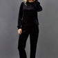 blonde model is wearing diva catwalk allium velvet sleeved high neck top in colour black front paired with diva black velvet trousers