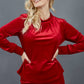 blonde model is wearing diva catwalk allium velvet sleeved high neck top in colour red front
