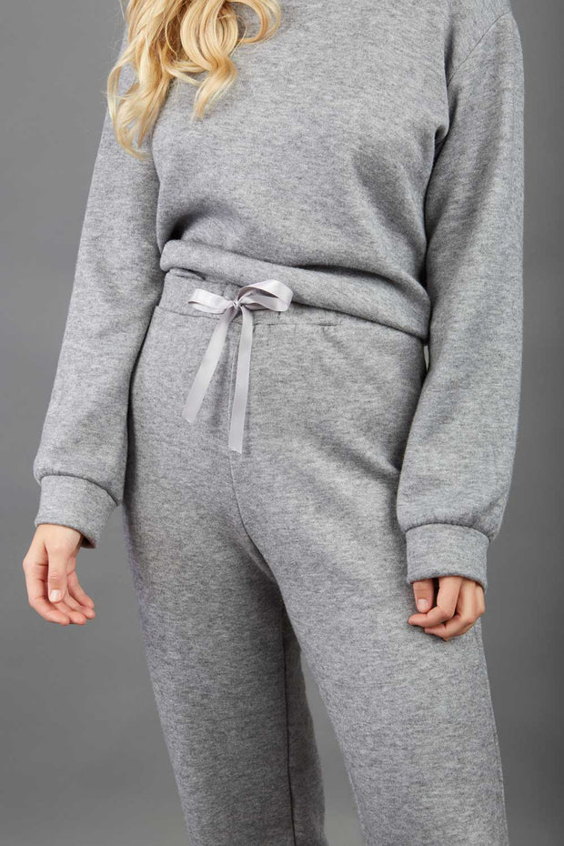 model wearing diva catwalk cosy soft touch cashmere joggers long leg with ribbon detail in flint grey sweat pants design front