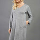 blonde model wearing diva catwalk irena cosy sleeved knee length dress with pockets and v-neckline in soft fabric grey front