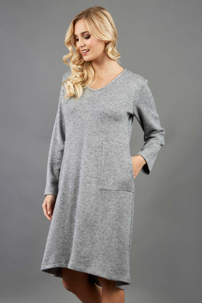 blonde model wearing diva catwalk irena cosy sleeved knee length dress with pockets and v-neckline in soft fabric grey front