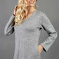 blonde model wearing diva catwalk irena cosy sleeved knee length dress with pockets and v-neckline in soft fabric grey front