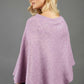 blonde model wearing diva catwalk rosalia poncho made in very cosy soft cashmere fabric in pink back