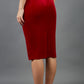 model is wearing diva catwalk triste velvet pencil skirt in red back
