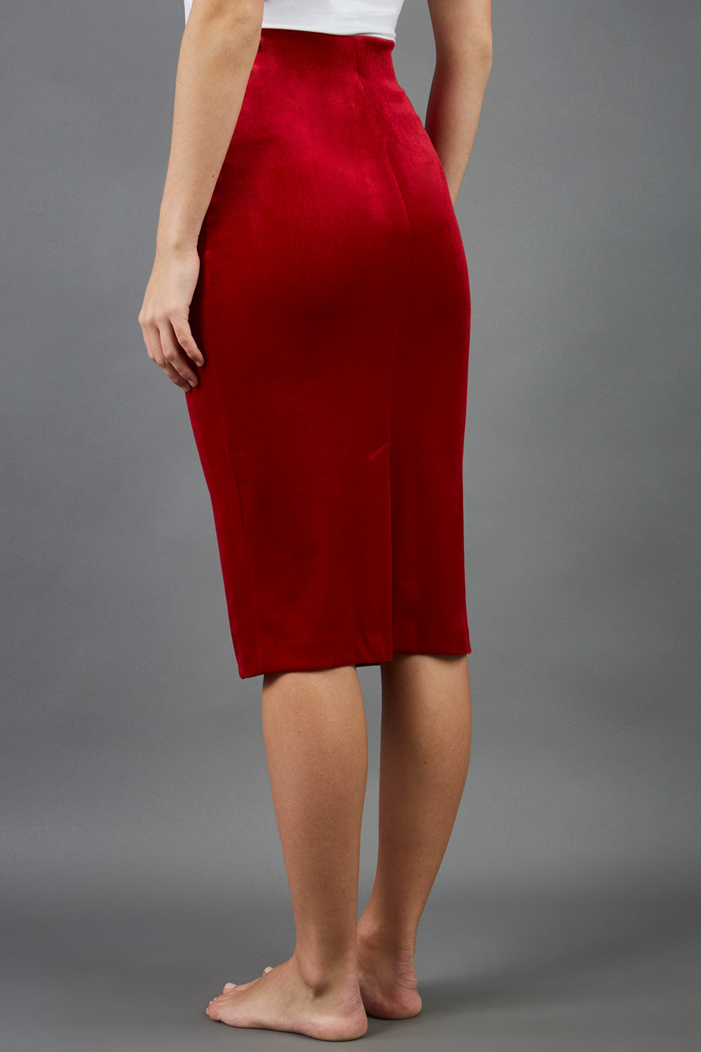 model is wearing diva catwalk triste velvet pencil skirt in red back