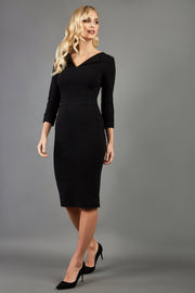 blonde model wearing damsel little black pencil dress with long sleeves and v neckline front