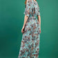 model is wearing diva catwalk maxi summer dress with short sleeve and a belt detail in pale blue print back