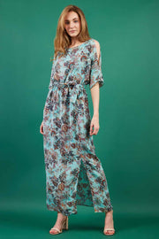 model is wearing diva catwalk maxi summer dress with short sleeve and a belt detail in pale blue print front