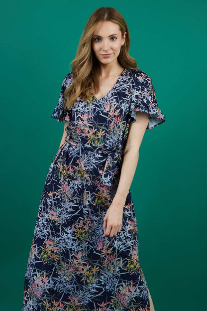brunette model is wearing diva catwalk carella short sleeve printed midi dress with a belt in navy floral print front