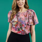 brunette model is wearing divacatwalk floral short sleeved printed top front