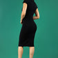 A brunetter model is wearing a pencil cap sleeve dress with the zip neckline detail in  black