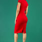 A brunetter model is wearing a pencil cap sleeve dress with the zip neckline detail in red