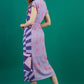 model is wearing diva catwalk midi length printed dress with short sleeves and belt detail in purple back