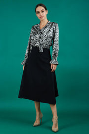 divacatwalk highfield midi a-line skirt in black front worn with divacatwalk ricky animal print long sleeved top