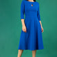 Brunette model is wearing diva catwalk casares swing dress with a keyhole neckline three quarter sleeve dress with pocket detail in cobalt blue front