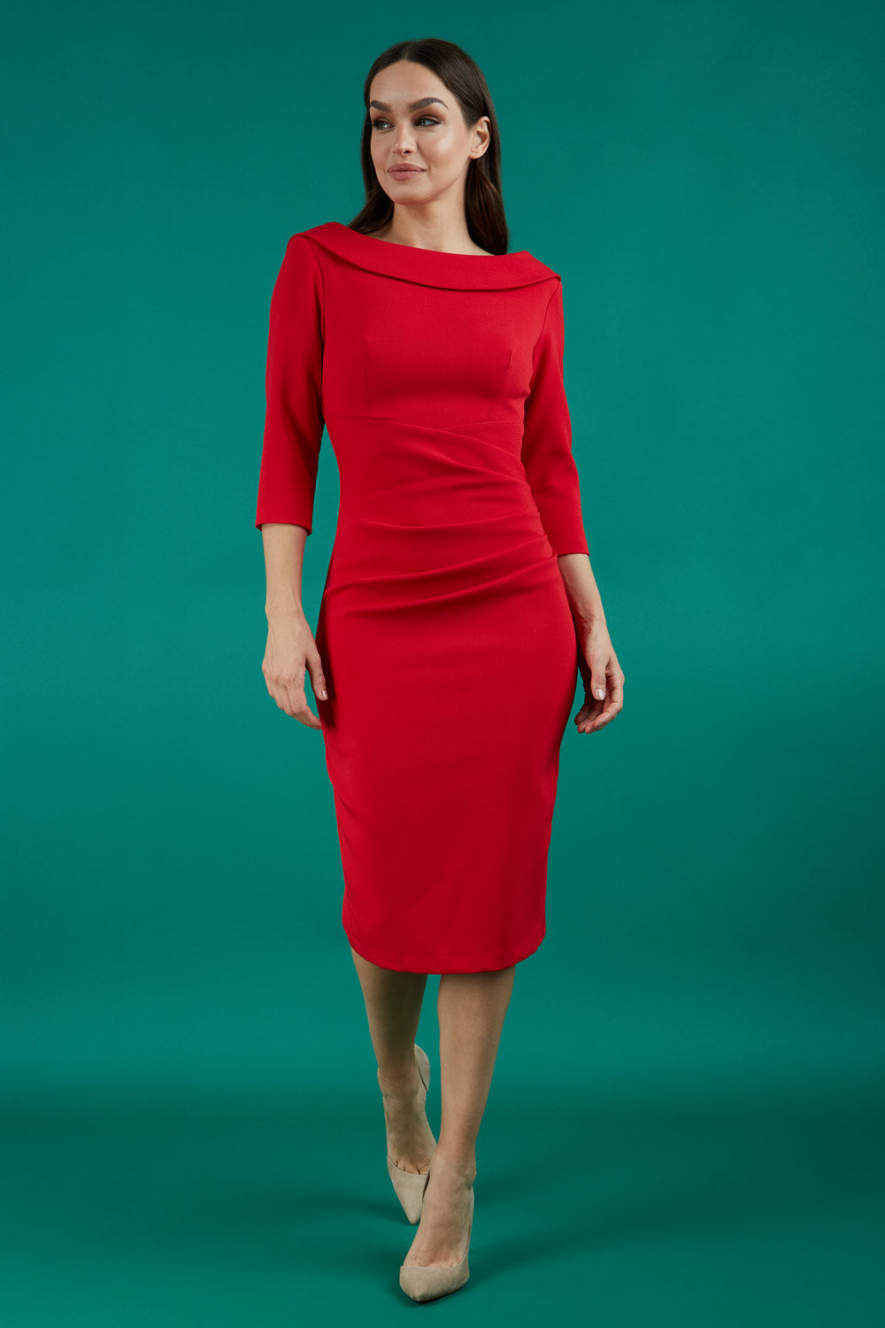 A brunette model is wearing a round neckline pencil dress with pleating on the tummy area in red front image