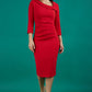 Brunette model is wearing a red pencil three quarter sleeve dress with assymetric neckline and pleating around tummy area