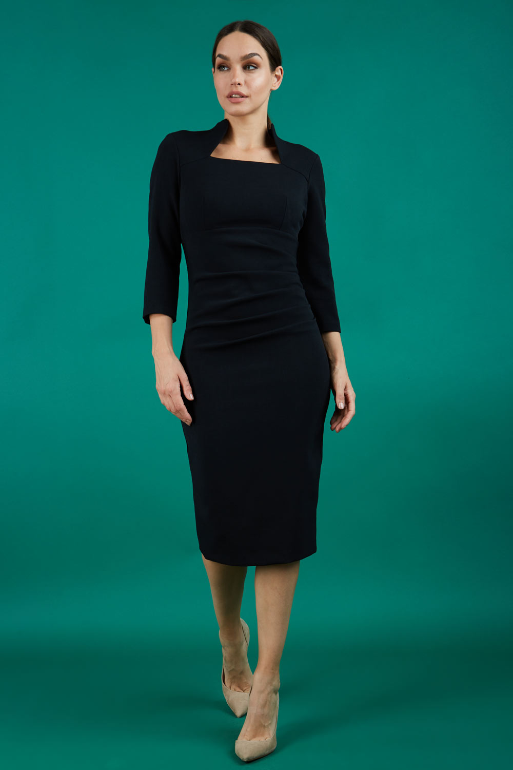model is wearing diva catwalk plaza sheath dress with high neck Trapezium neckline cutout and three quarter sleeve pretty dress in black front