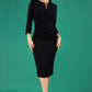 model is wearing diva catwalk chandos sheath dress with three quarter sleeve and slit in the middle of the neckline in black front