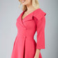 model is wearing diva catwalk gatsby swing dress with pocket detail and wide v-neck collar and buttons down the front panel in pink side close up