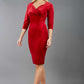A blonde model is wearing a velvet pencil sweetheart neckline dress by diva catwalk in red 