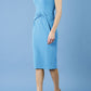 model is wearing diva catwalk Ester cap sleeve pencil dress with v-neck and bow detail at the front in malibu blue side