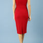 model is wearing diva catwalk Ester cap sleeve pencil dress with v-neck and bow detail at the front in tango red back