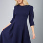 blonde model is wearing diva catwalk harpsden a-line skirt 3/4 sleeve swing dress with rounded neckline in navy blue front