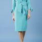 blonde model is wearing diva catwalk mulberry pencil off-shoulder dress with a bow detail on 3/4 sleeves and criss cross on a front panel in aqua green front