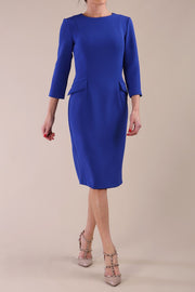 Model wearing diva catwalk Elsinor 3/4 Sleeve pencil skirt dress front with two side pockets in Cobalt Blue 