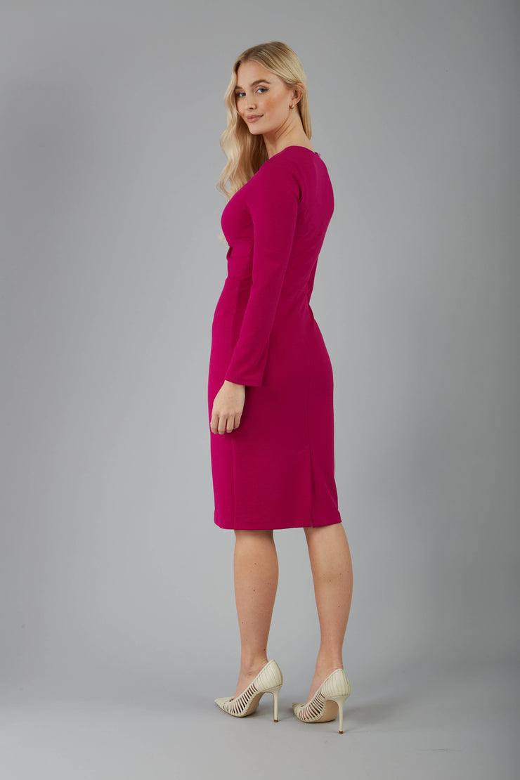blonde model is wearing diva catwalk gately pencil dress with long sleeves and twisted low v-neck in magenta back