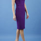 blonde model is wearing diva catwalk laurentia pencil odd shoulder dress with bardot neckline with gathering on shoulders in passion purple colour front