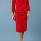 model is wearing diva catwalk miracle pencil dress with keyhole detail on a side of the front panel and gathering detail on a side or bodice panel with sleeves in scarlet red colour front