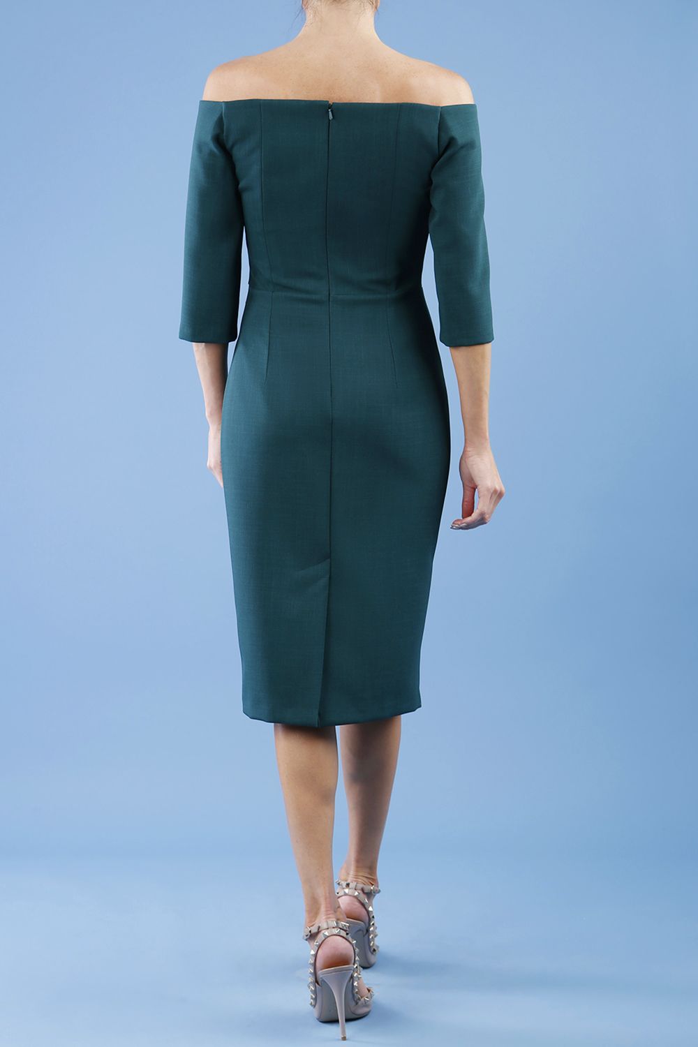 model is wearing diva catwalk lauren odd shoulder asymmetric neckline pencil dress with sleeves in forest green back