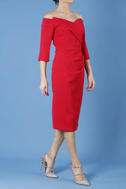 model is wearing diva catwalk lauren odd shoulder asymmetric neckline pencil dress with sleeves in scarlet red front