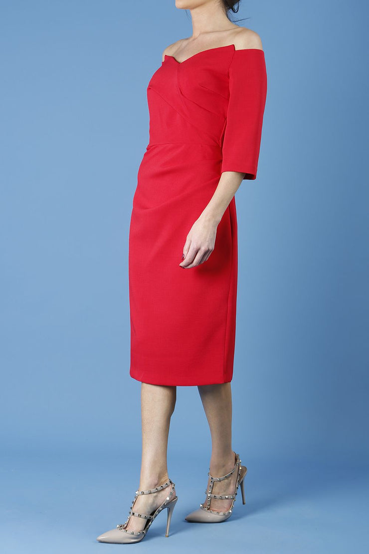 model is wearing diva catwalk lauren odd shoulder asymmetric neckline pencil dress with sleeves in scarlet red front