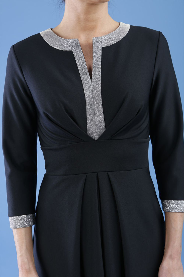 model is wearing diva catwalk carolyn swing midi dress with a band and glitter detail on sleeves and around the neckline in black detail