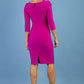 brunette model is wearing diva catwalk pencil dress with collar and a button detail on a side with 3/4 sleeve in magenta haze back