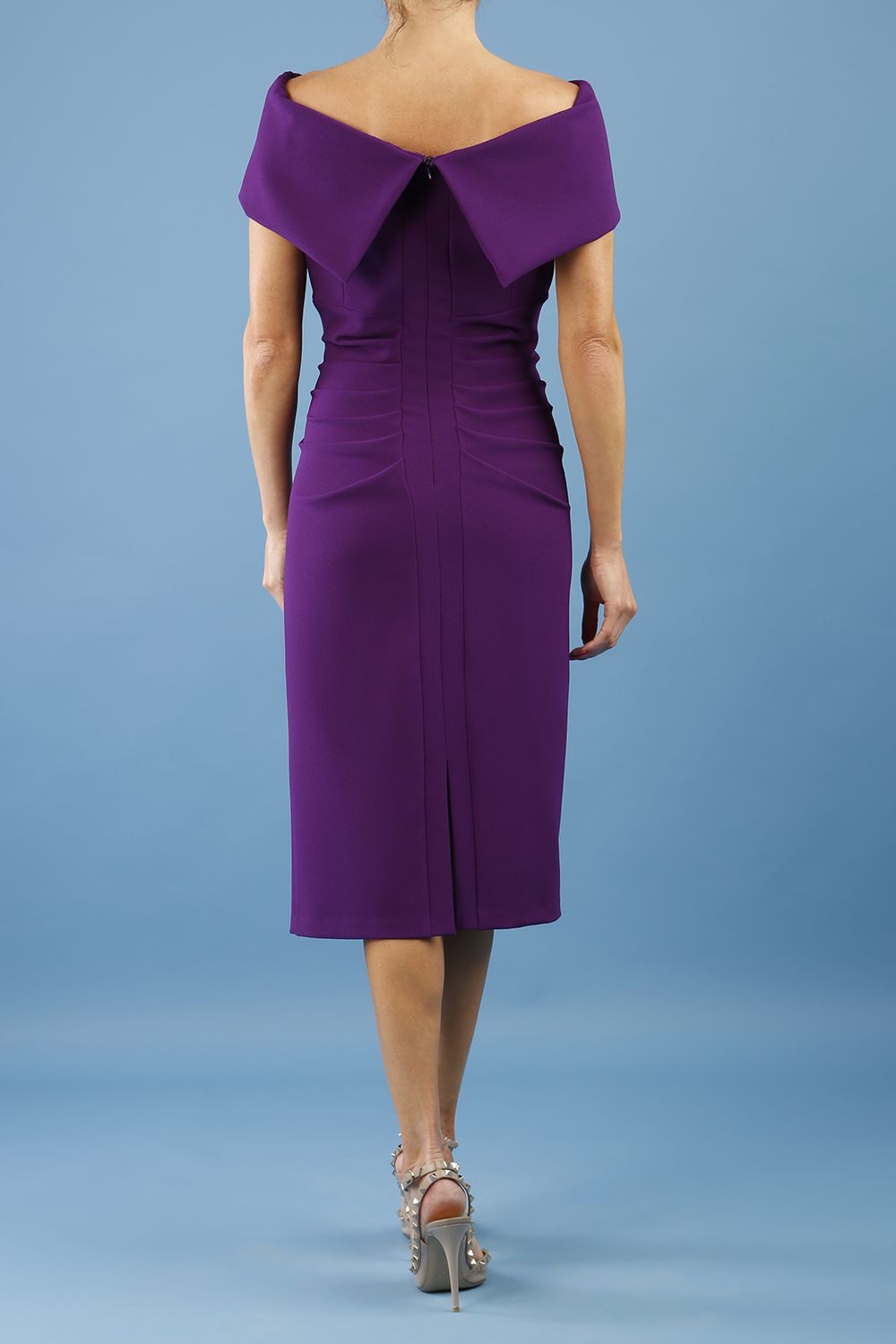 model is wearing diva catwalk amelia pencil dress with bardot neckline and ruched back in passion purple back