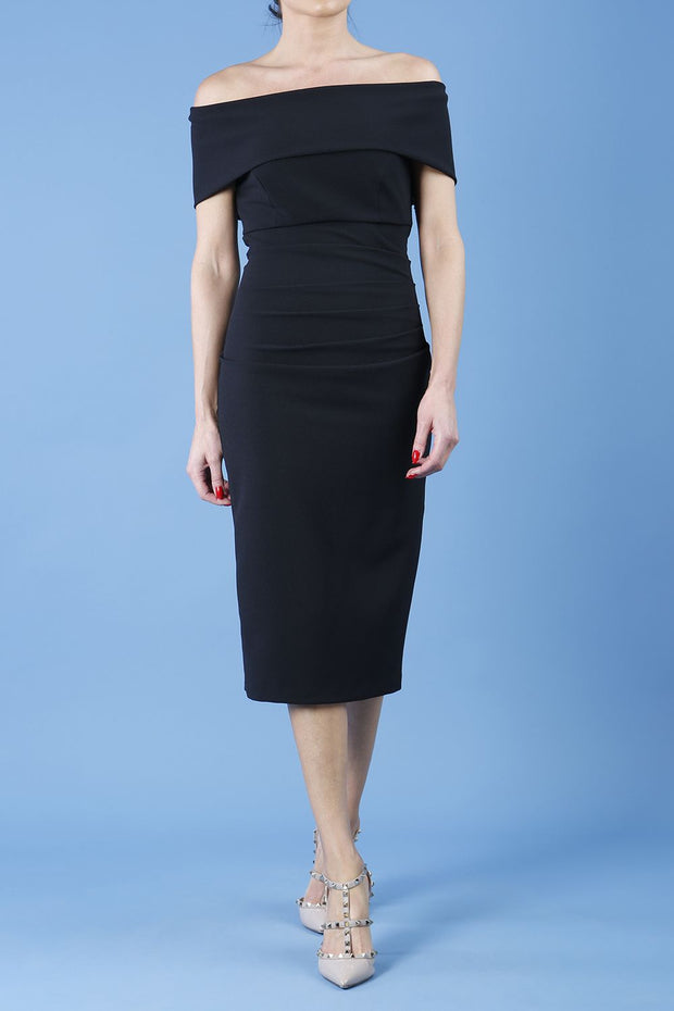 model is wearing diva catwalk amelia pencil dress with bardot neckline and ruched back in black front